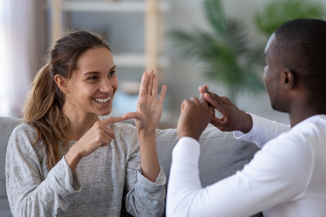 Couple with hearing loss communicate with each other
