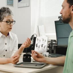 Man talking about hearing aid fitting options