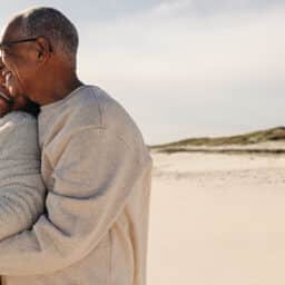 Happy couple embraces on a beach