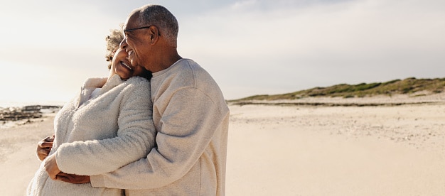 Happy couple embraces on a beach